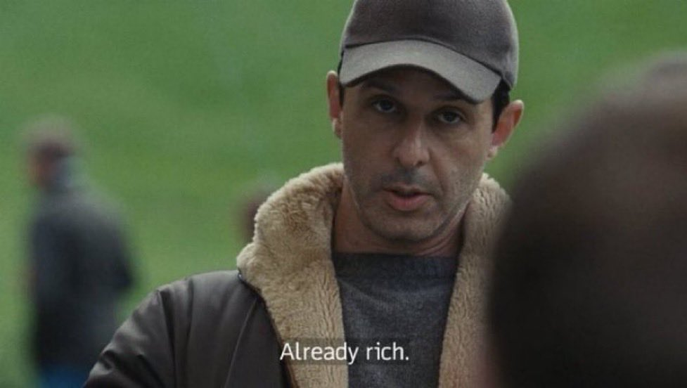 Man in a cap saying already rich