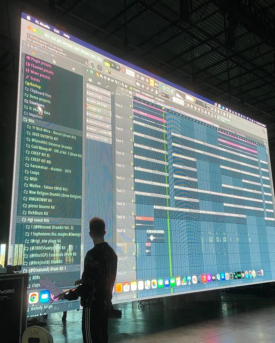A person standing before a huge FL Studio project screen