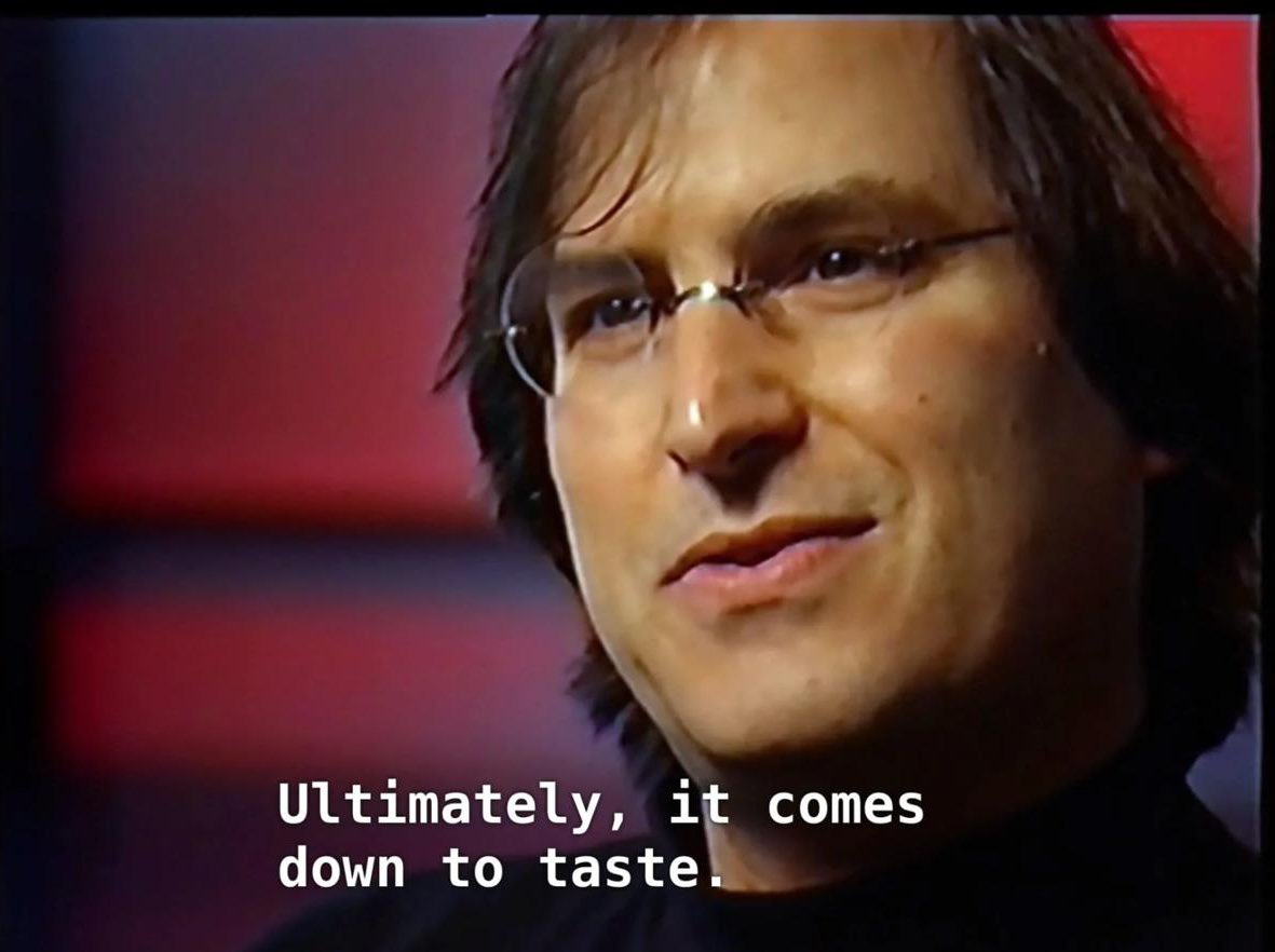 Close-up interview still of Steve Jobs with subtitles